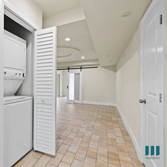 hallway with in-suite washer & dryer