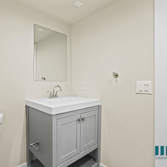 bathroom with vanity cabinet storage