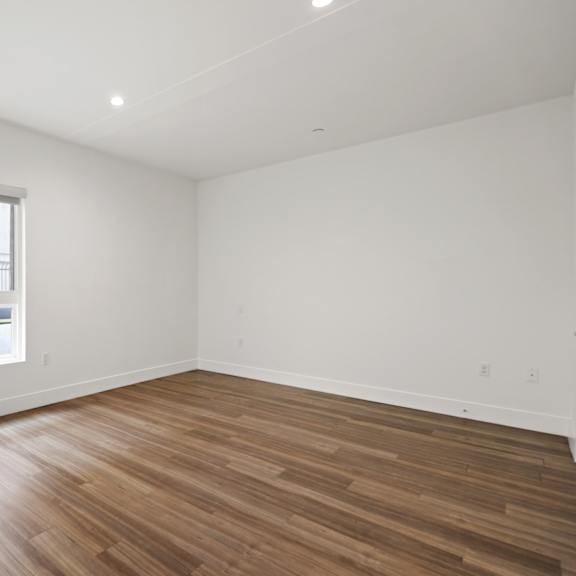 bedroom with recessed lighting, vinyl flooring, and large-size windows
