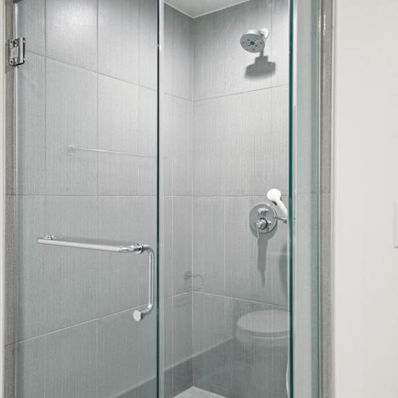 bathroom with stand-up shower with glass door