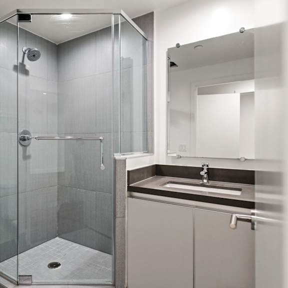 bathroom with stand-up shower with glass door