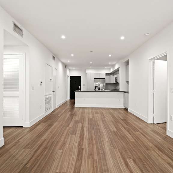 open-concept kitchen, dining, and living room space
