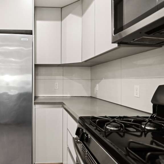 kitchen with stainless-steel refrigerator, stove, and microwave oven