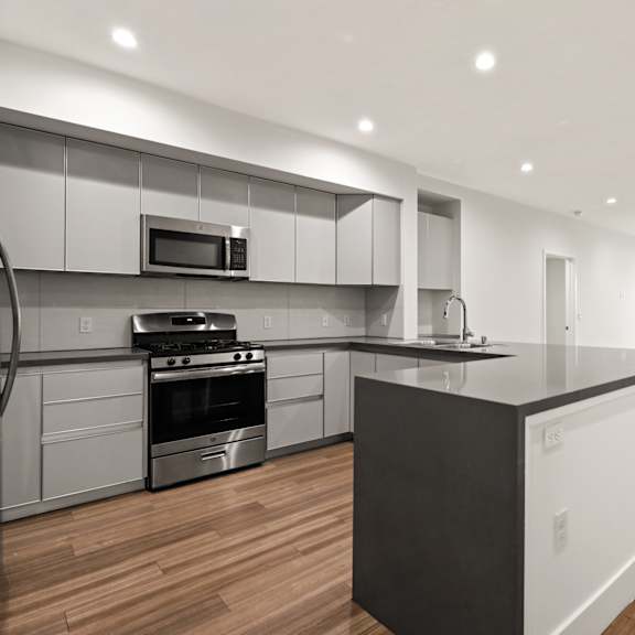 full-size kitchen with countertop bar