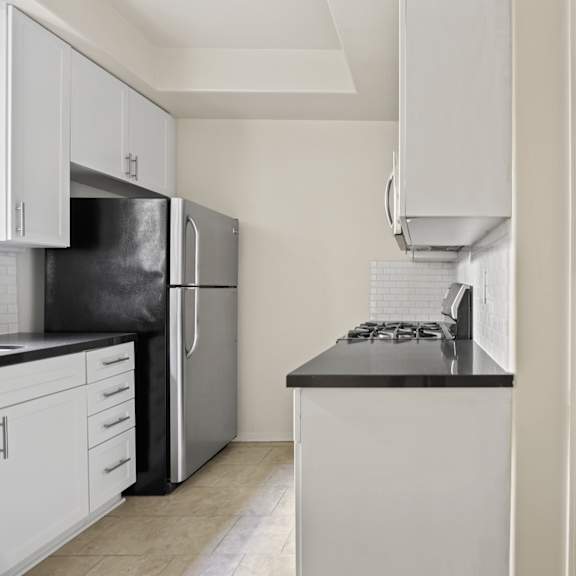 kitchen and bathroom of studio apartment