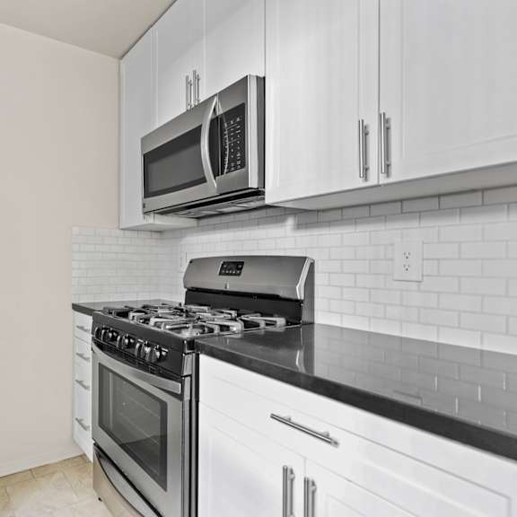 kitchen with stainless-steel refrigerator, stove, and microwave oven
