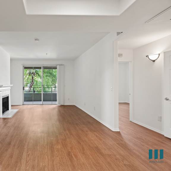 open-concept kitchen, dining, and living room areas