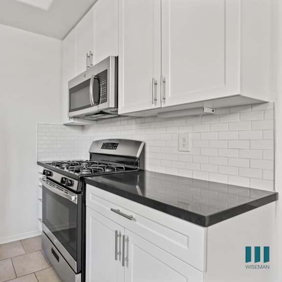 kitchen with stainless-steel refrigerator, stove, and microwave oven