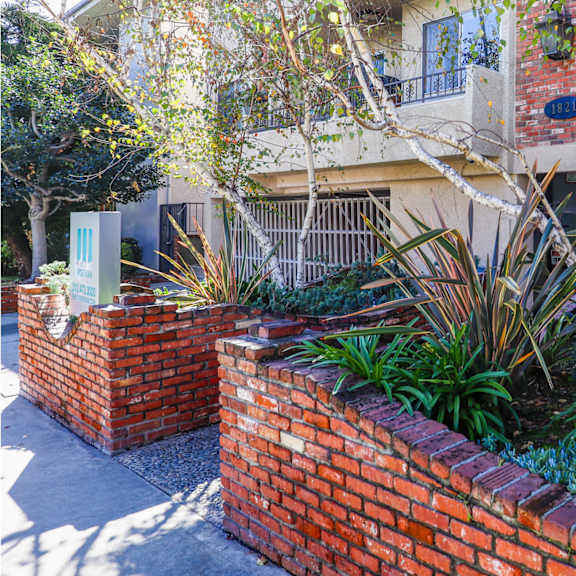 sidewalk entrance of bentley woodland by wiseman