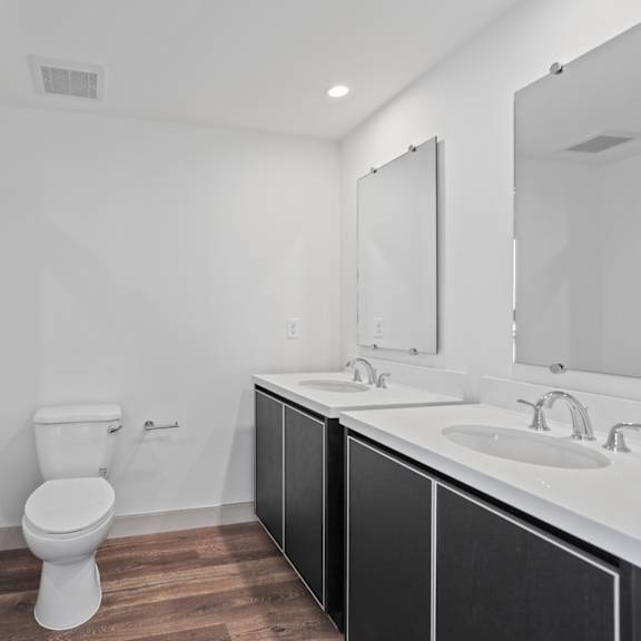 a bathroom with a toilet sink and shower