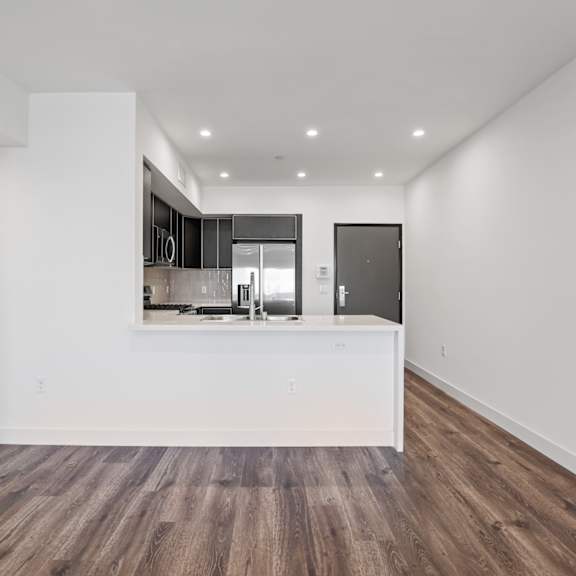 a kitchen and dining area in a 555 waverly unit
