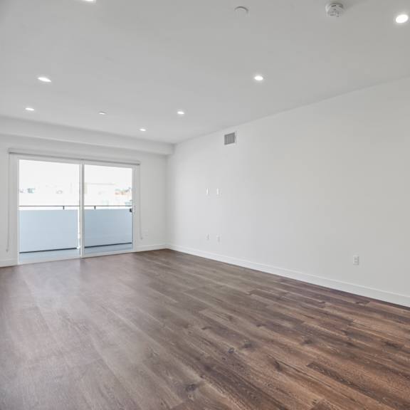 large-size living room with recessed lighting, vinyl flooring, and patio