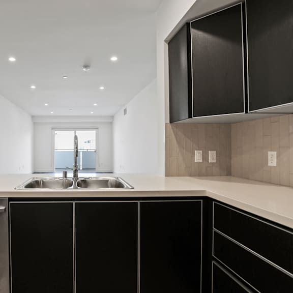 open-concept kitchen, dining, and living room space