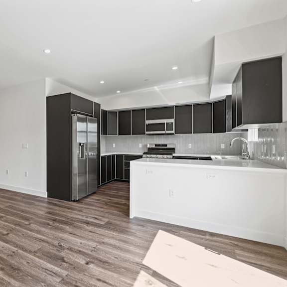 a kitchen and living room in an apartment