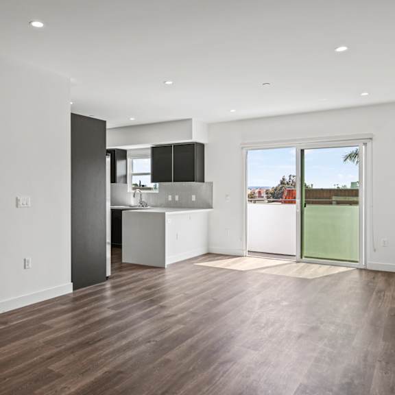 a kitchen and living room in a 555 waverly unit