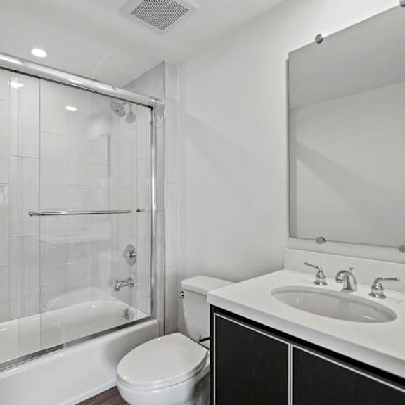 a bathroom with a bathtub toilet and sink