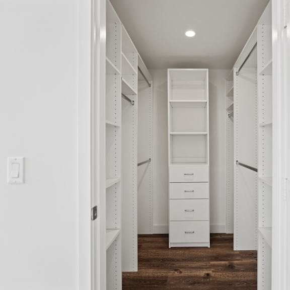 a walk in closet in a 555 waverly unit