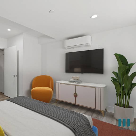 spacious bedroom with built-in cabinet storage