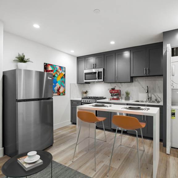 open-concept kitchen with in-suite washer & dryer