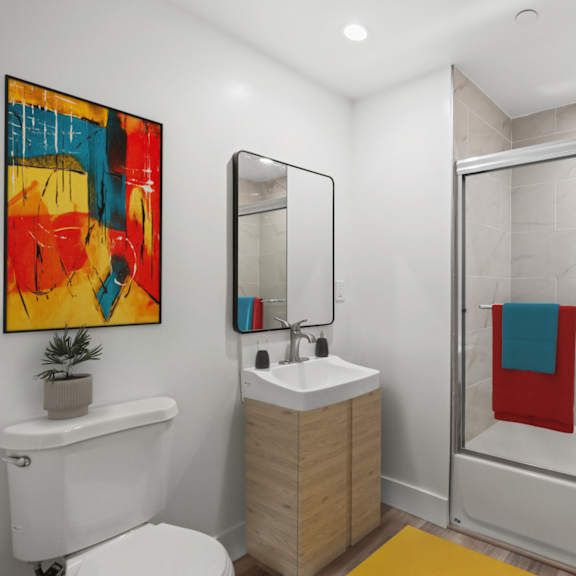 bathroom with shower bath and vanity cabinet storage