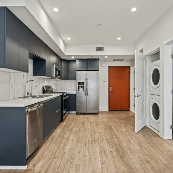 kitchen with energy-efficient appliances and in-suite washer & dryer
