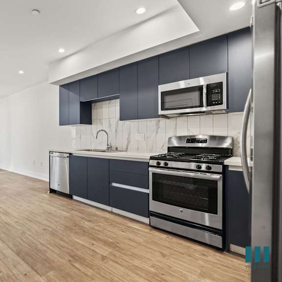 open-concept kitchen, dining, and living room space