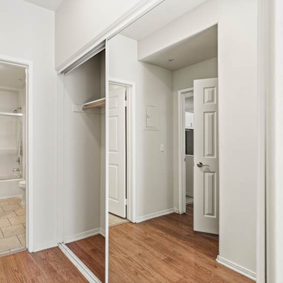 bedroom with closet and bathroom