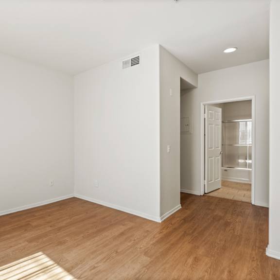 bedroom with closet and bathroom