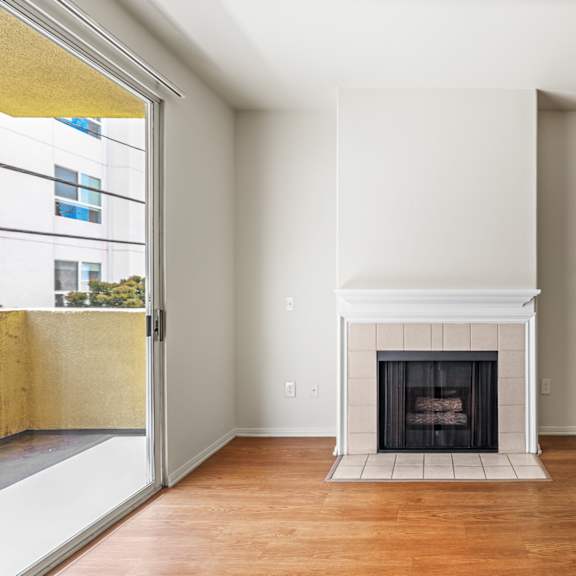 living room with electric fireplace and patio