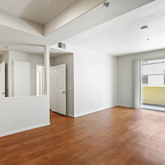 dining and living room area with patio