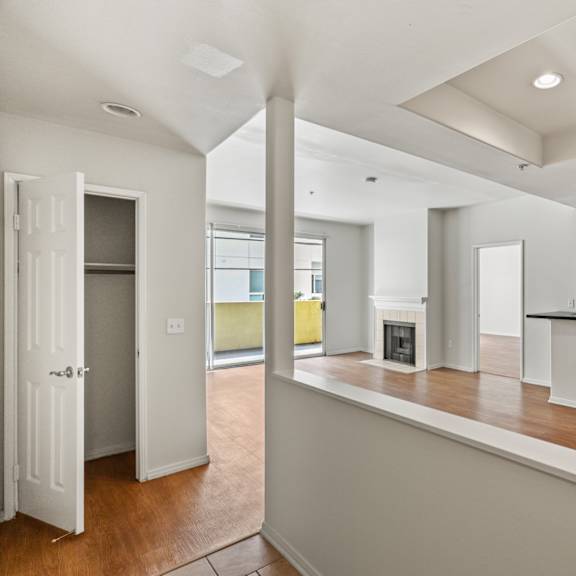 front entrance with hall closet, dining room, and kitchen