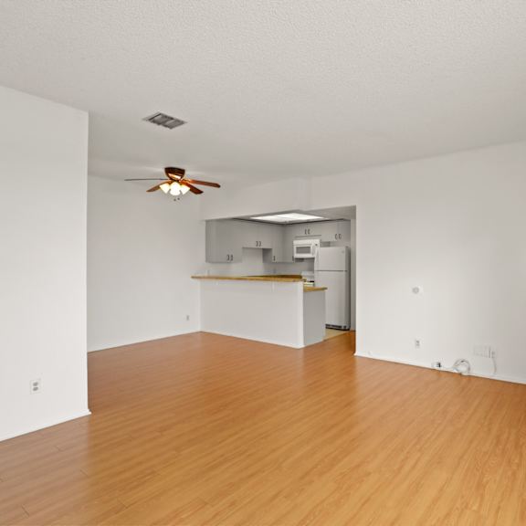 open-concept kitchen, dining, and living room areas