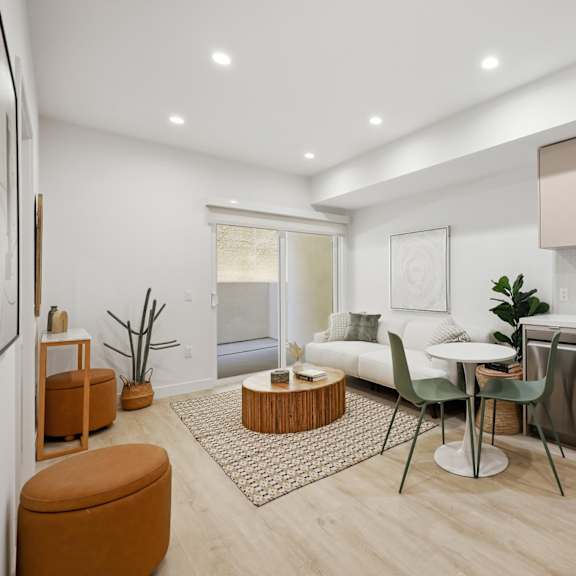 open-concept floor plan with a patio, recessed lighting, and vinyl flooring