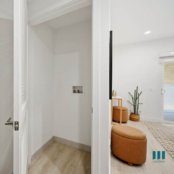 a bathroom with a white door and a white sink.