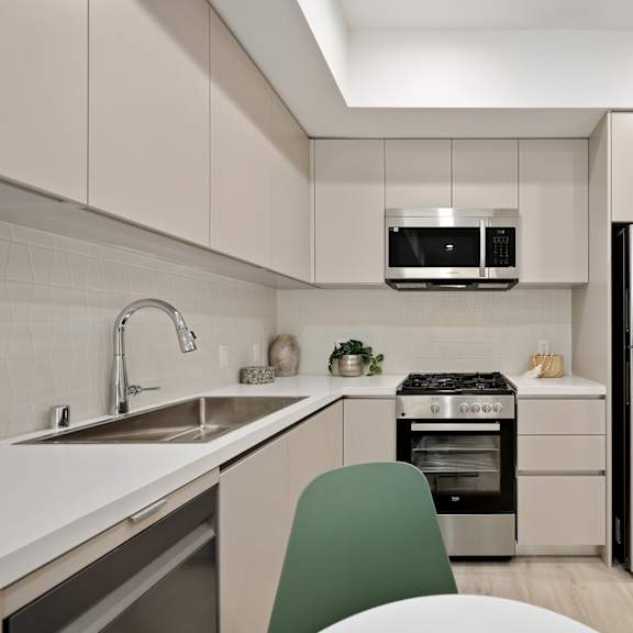 kitchen with stainless steel refrigerator, stove, microwave oven, and dishwasher