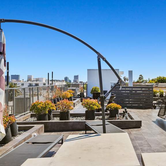 rooftop with entertainment area at gramercy park by wiseman, los angeles, california