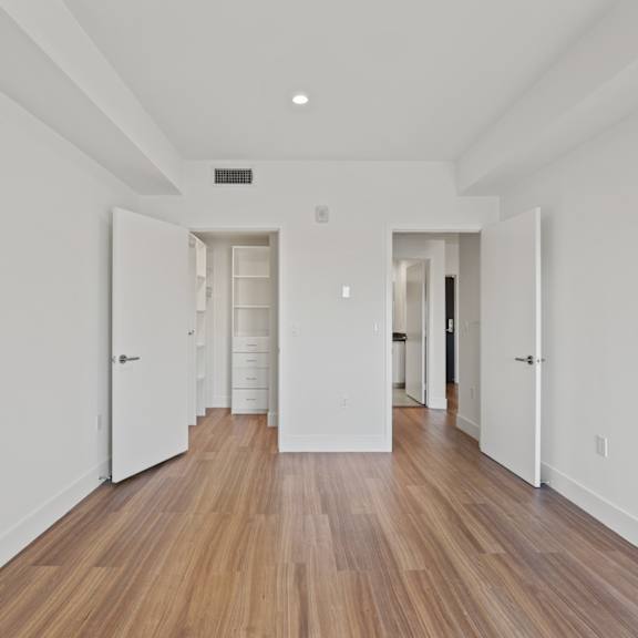 bedroom with walk-in closet at gramercy park by wiseman, los angeles