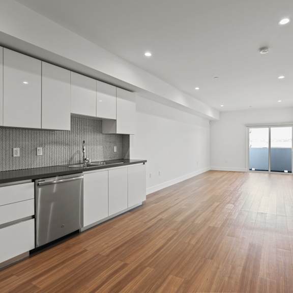living room space with patio at gramercy park by wiseman, los angeles, 90004