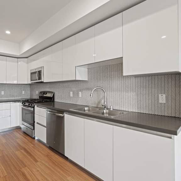 kitchen with ample cabinet storage at gramercy park by wiseman, los angeles, ca, 90004