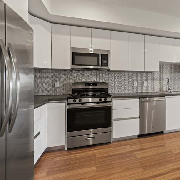 kitchen with efficient appliances at gramercy park by wiseman, los angeles