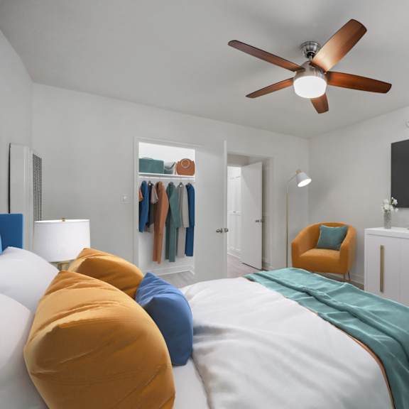 a bedroom with a bed, a chair, a cabinet, a plant, and a ceiling fan.
