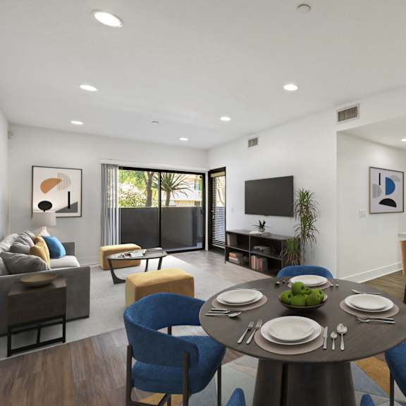 dining and living room with patio