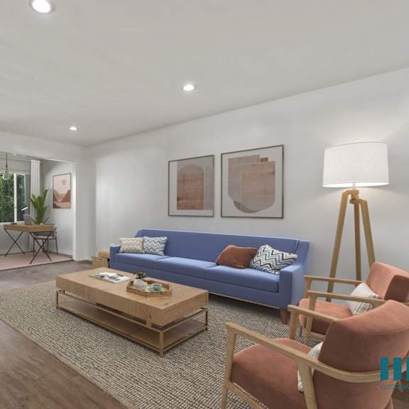 open-concept living room, office nook, and dining room with large-size windows