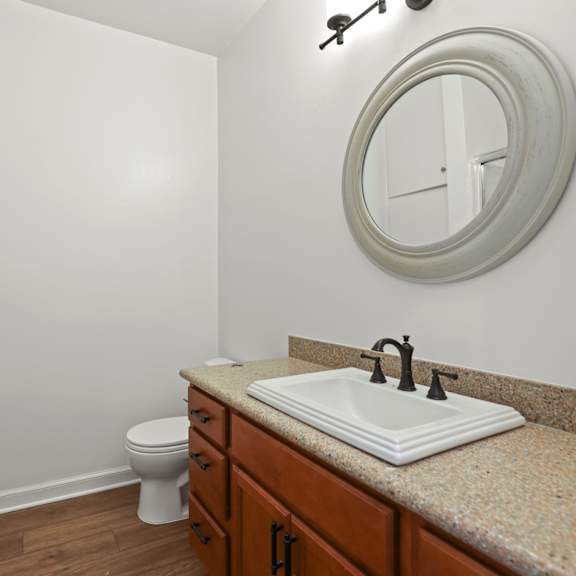 bathroom with walk-in shower and vanity
