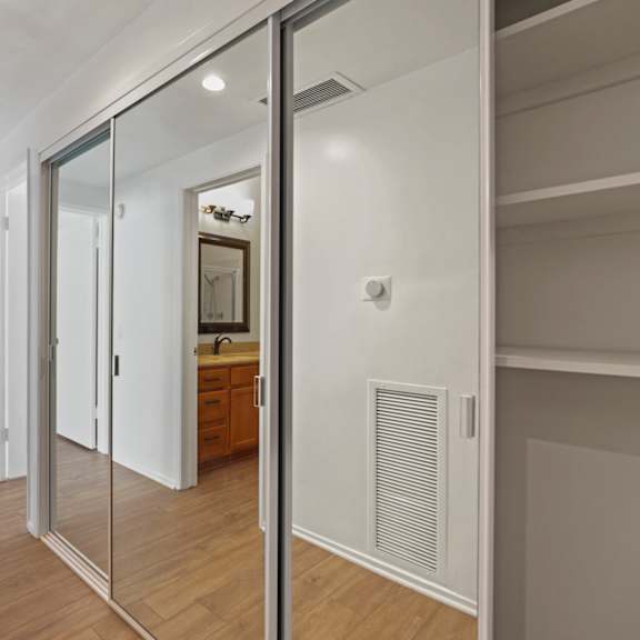 bedroom closet with built-in shelving