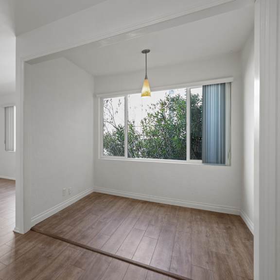 open-concept dining, living room, and office space