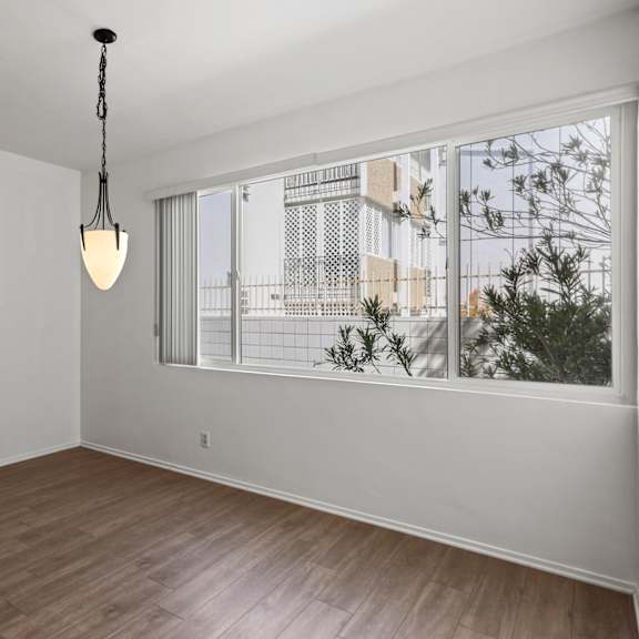 dining room with large-size window and vinyl flooring