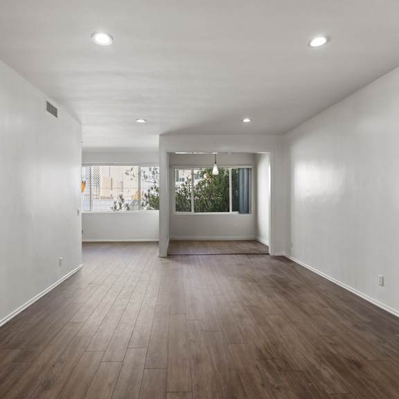 open-concept living room, dining room, and office space