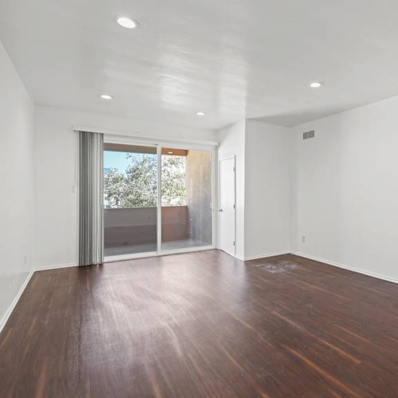living room area with recessed lighting, vinyl flooring, and patio