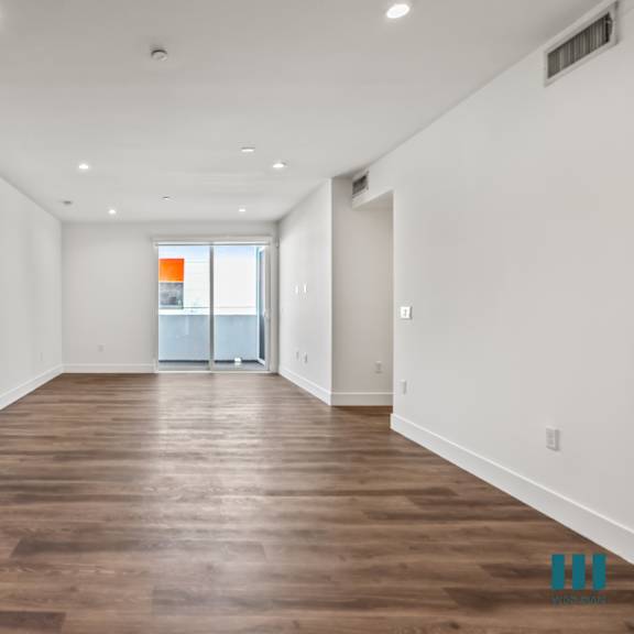 living room with patio, recessed lighting, and vinyl flooring